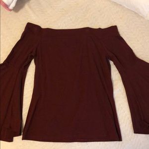 Express off the shoulder top with wide arms.